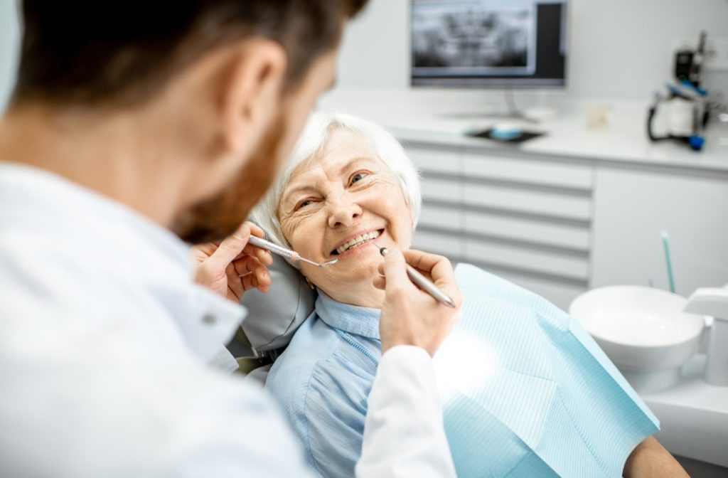 An older woman feeling comfortable and relaxed during her regular dental exam