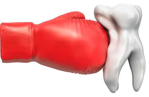 A 3D rendering of a tooth getting hit by a boxing glove to simulate a tooth injury
