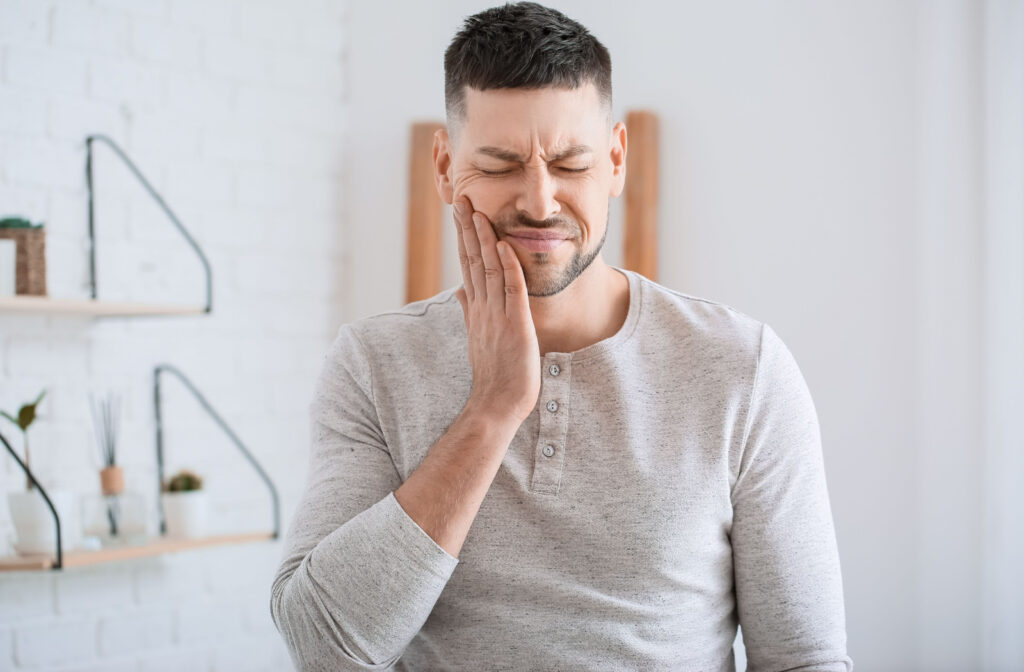 A man experiencing sudden tooth pain.